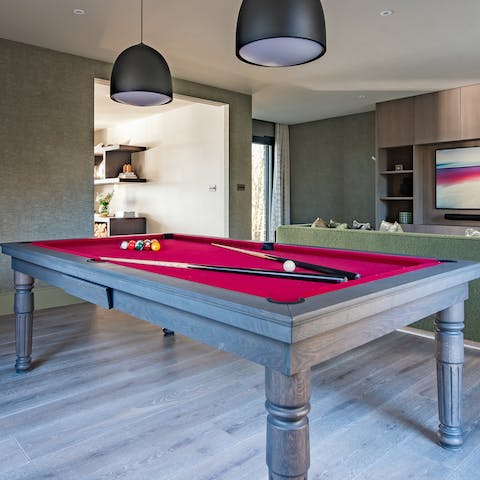 While away rainy afternoons with the assistance of the pool table