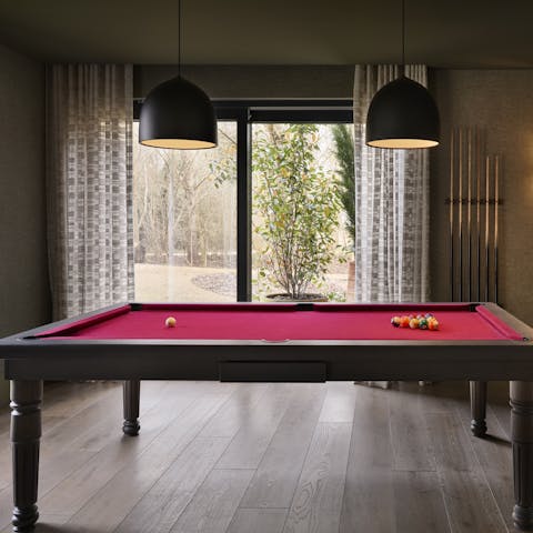 While away rainy afternoons with the assistance of the pool table