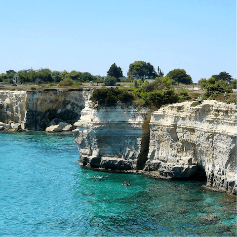 Take a road trip along the coast to explore the region's beaches and coves