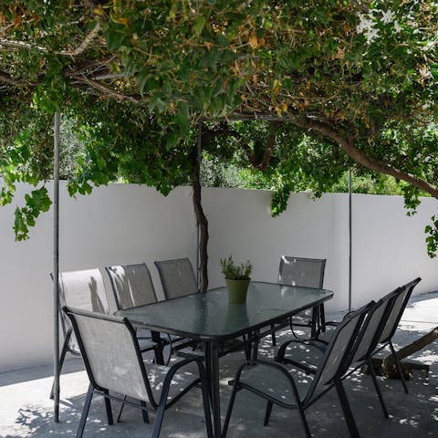 Share leisurely breakfasts under the vine-wrapped pergola