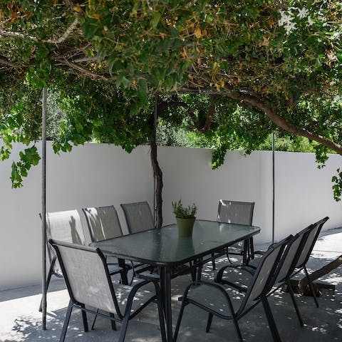 Share leisurely breakfasts under the vine-wrapped pergola