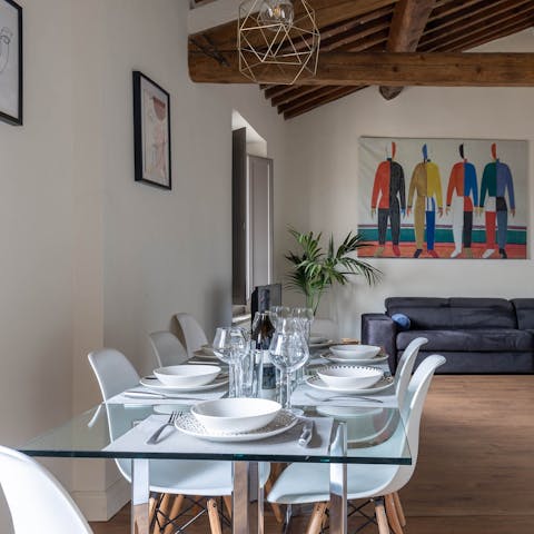 Dine as a group beneath the old wood-beamed ceiling