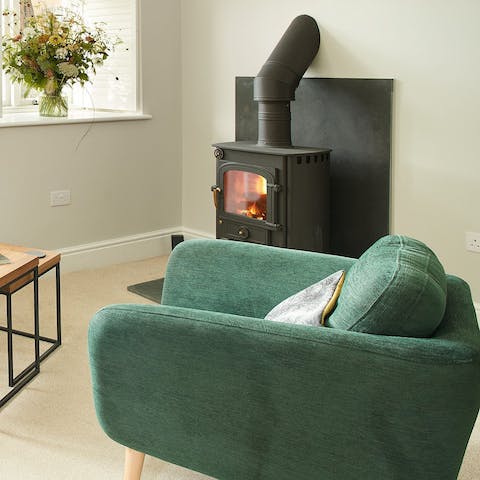 Warm up in front of the wood burner on a chilly evening