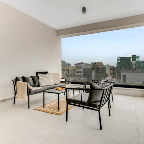 Gather on the open terrace with a glass of wine as the city unfolds