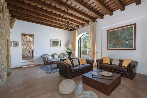 Settle into a grand living room steeped in Sicilian character