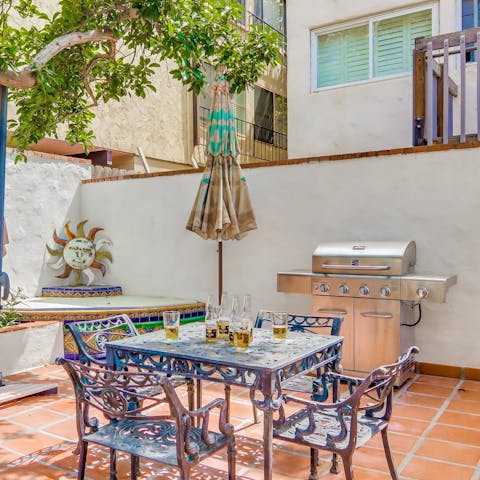 Fire up the grill and tuck into an alfresco feast on the patio