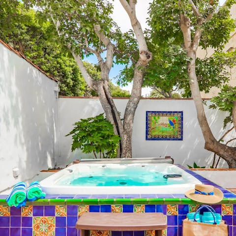 Unwind with a dip in the bubbling hot tub