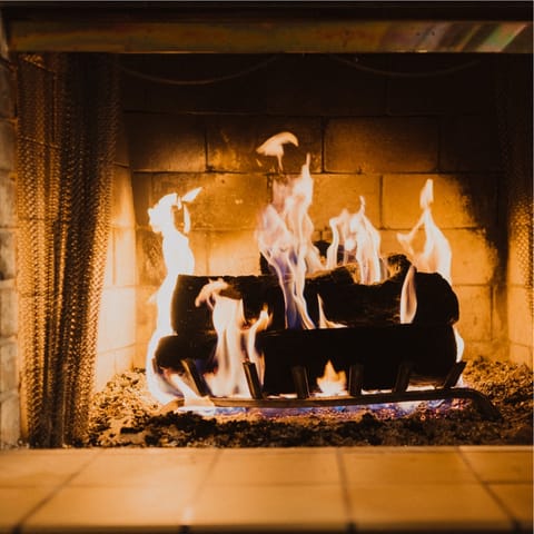 Spend cosy evenings curled up by the fireplace