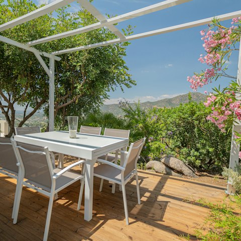 Dine al fresco under the picturesque pergola