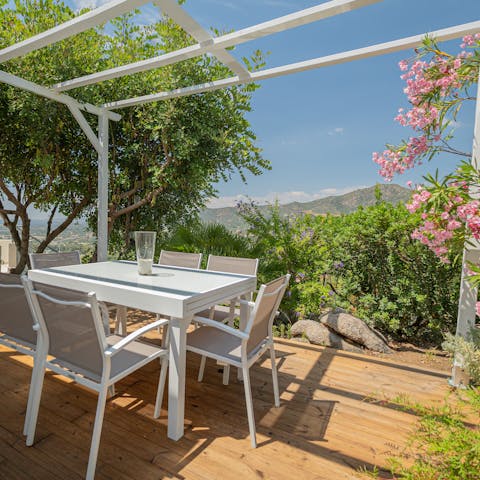 Dine al fresco under the picturesque pergola