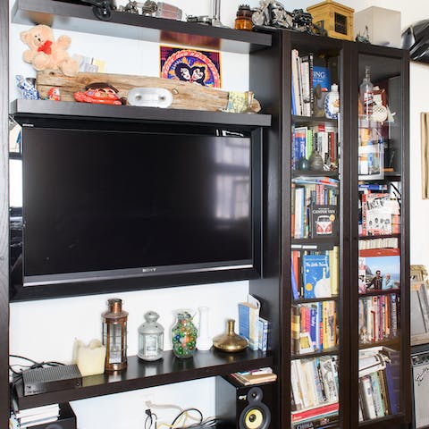 Pick a book from the collection, or admire the host's quirky trinkets