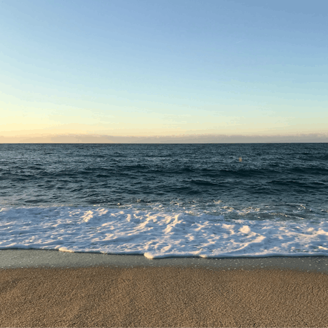 Sink your feet into the sand at Vilamoura beach, ten minutes away