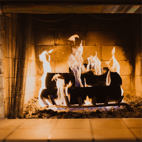Sip a hot cup of tea by the cosy woodburner