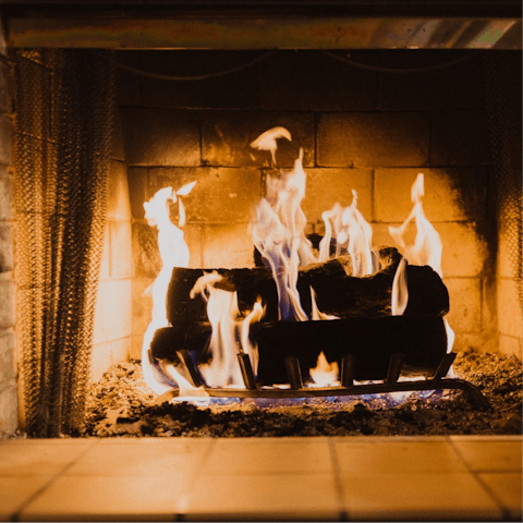 Sip a hot cup of tea by the cosy woodburner