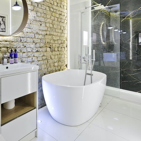 Soak in the tub with a glass of champagne in hand