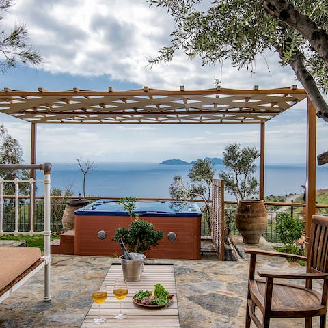 Sip on a glass of red in the hot tub as you watch the sunset