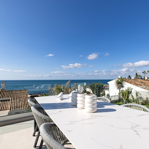 Relax on the terrace, where you may spot dolphins swim by