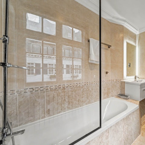 Sink into the bathtub after a day exploring the city