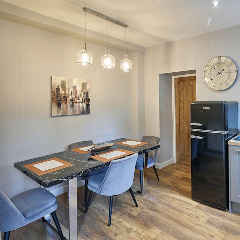 Gather everyone around the elegant dining table for a Sunday roast, with all the trimmings