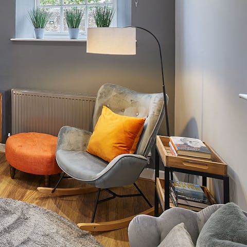 Relax on the rocking chair and have a browse through the host's coffee-table books