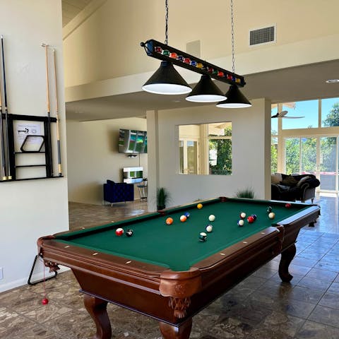 Go up against each other in a game of pool