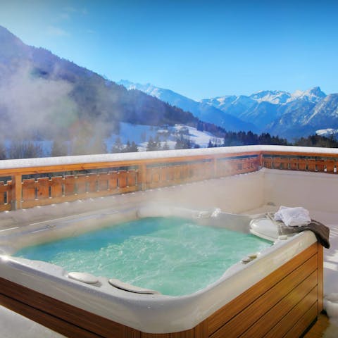 Sip Champagne in the hot tub amid the mountains