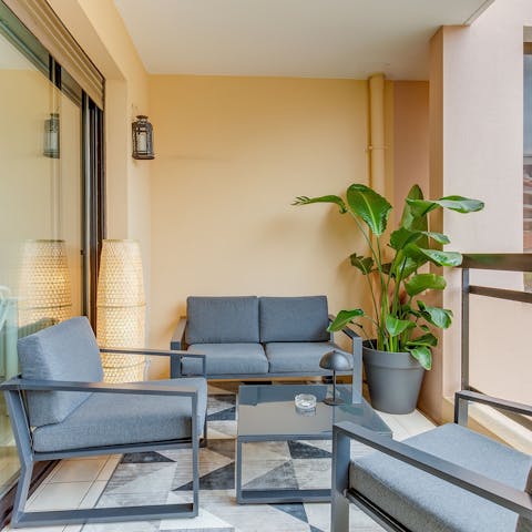 Enjoy coffee or cocktails on the private balcony