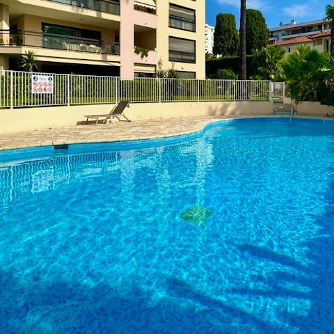 Take a refreshing dip in the shared swimming pool
