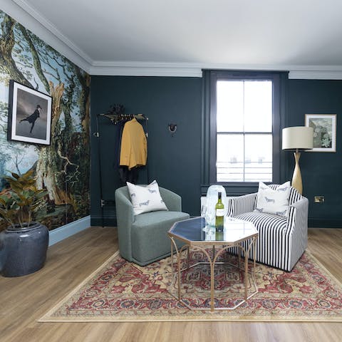 Unwind with an evening glass of wine and watch the world go by from the window
