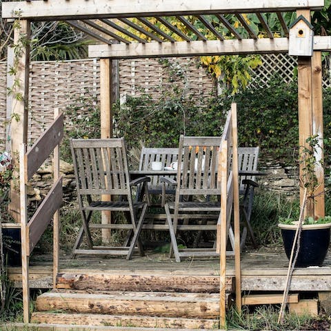 Enjoy an alfresco barbecue beneath the garden's pergola