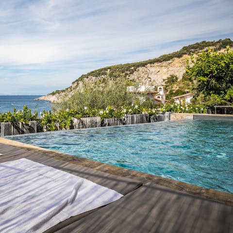 Feel the breeze from the warmth of the private infinity pool