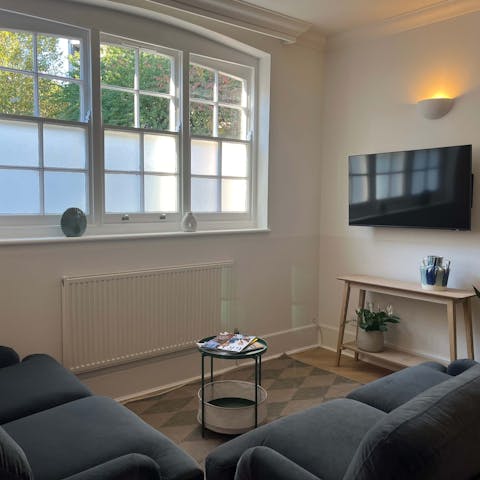 Relax with a book in the cosy, light-filled living space