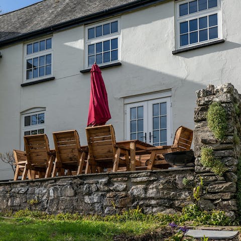 Enjoy an alfresco meal served outside on the sunny patio