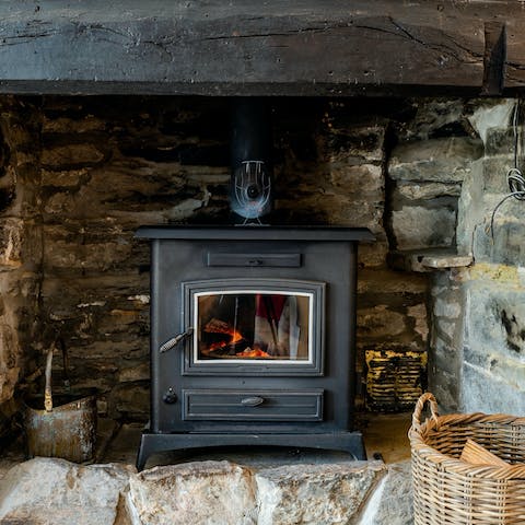 Huddle around the wood-burning stove on chilly winter evenings