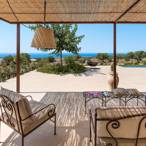 Take in the Mediterranean Sea views from the veranda
