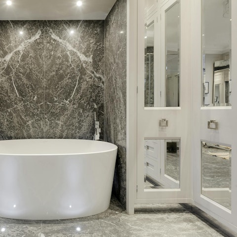 Enjoy a pre-dinner soak in the luxurious bath tub