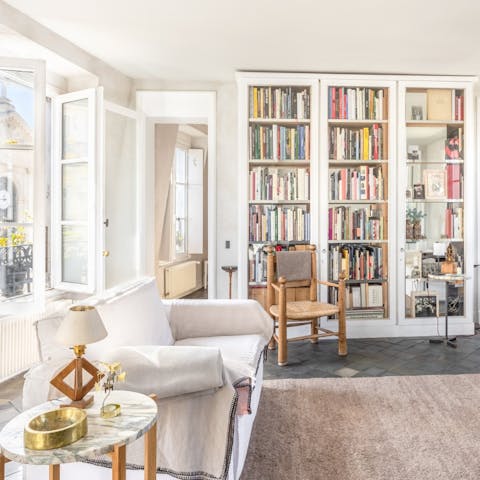 Curl up in the armchairs with a book from the host's collection