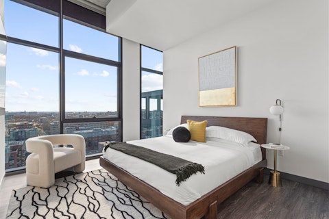 Wake to Chicago skyline views from the main bedroom