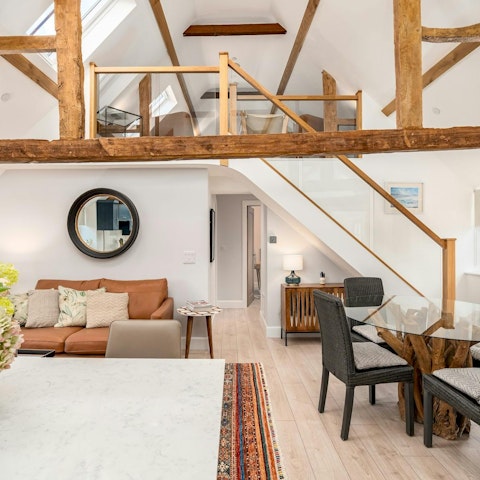 Admire the loft's original beams dating back to 1580