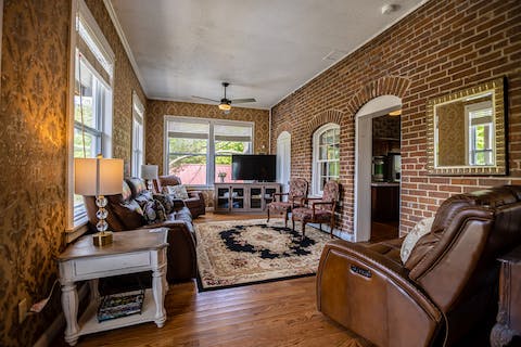 Get cosy in the living space with beautifully exposed brickwork