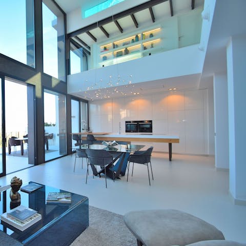 Entertain in the impressive double-height living space with its gourmet kitchen
