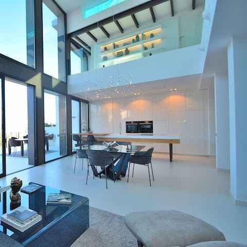 Entertain in the impressive double-height living space with its gourmet kitchen