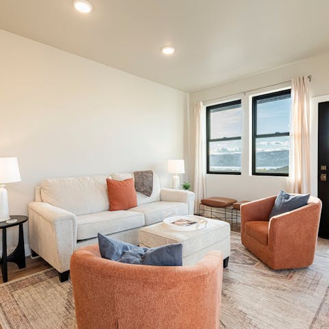Soak up mountain views as you lounge on the sofa