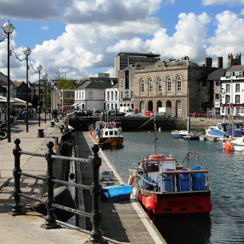 Explore Sutton Harbour Marina, a twenty-minute drive away