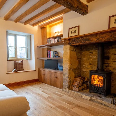 Snuggle up in front of the wood burner after a day outdoors