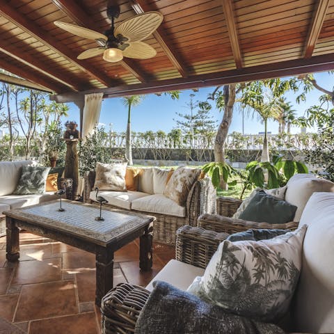 Relax under the shade by this outdoor seating area