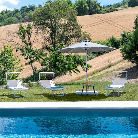 Spend well-deserved lazy days lounging beside the pool