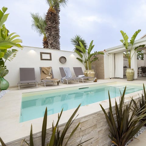 Spend sunny days chilling round the private pool
