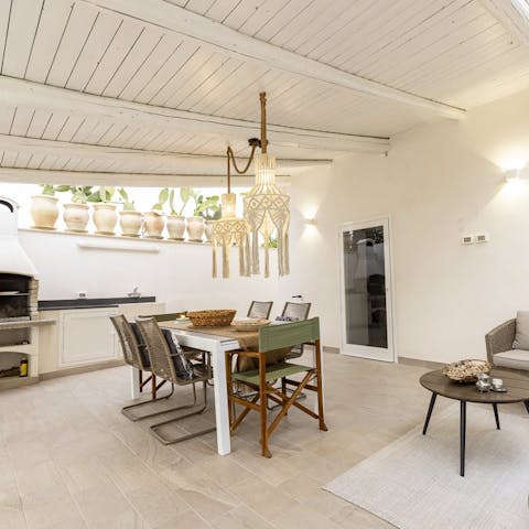 Host al fresco dinners in the outdoor living and dining area