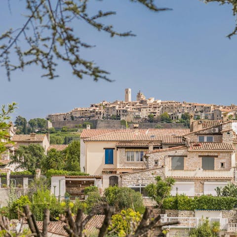 Admire the stunning views of the village of St Paul De Vence from the garden